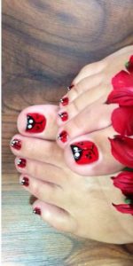 Ladybug painted toe nails