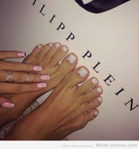 Sexy pink and painted fingernails and white toes