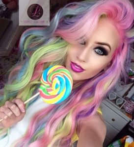 Rainbow colored hair chick about to lick a rainbow lollli