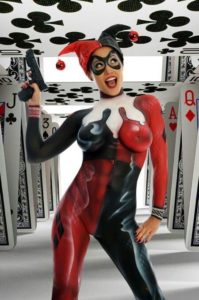 woman in card suit joker outfit, body painted